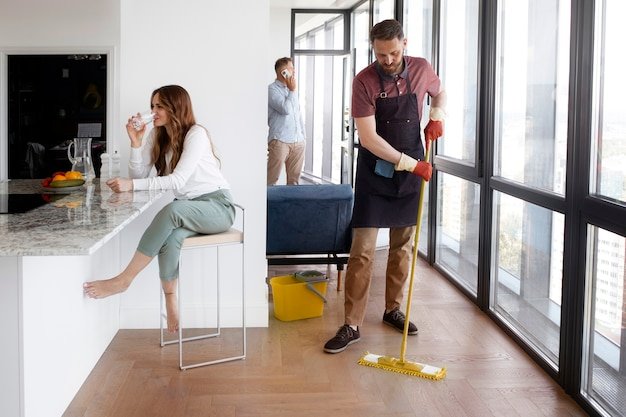 S/B Cleaning Expertise professional mopping floor in a modern home in Texas